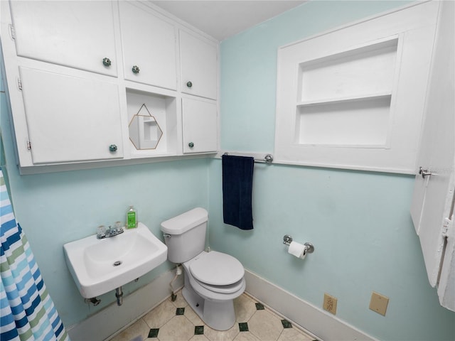 bathroom with toilet and sink