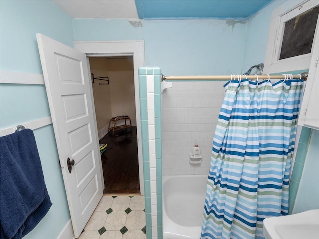 bathroom with shower / bath combination with curtain
