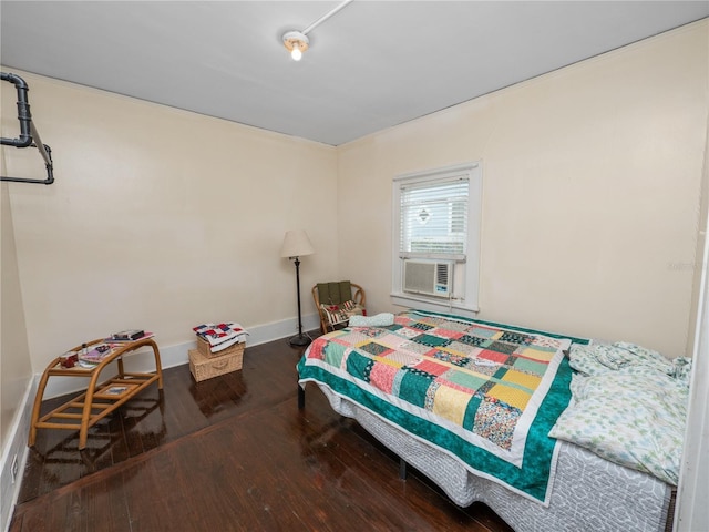 bedroom featuring hardwood / wood-style flooring and cooling unit