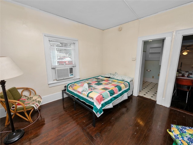 bedroom featuring cooling unit and wood-type flooring
