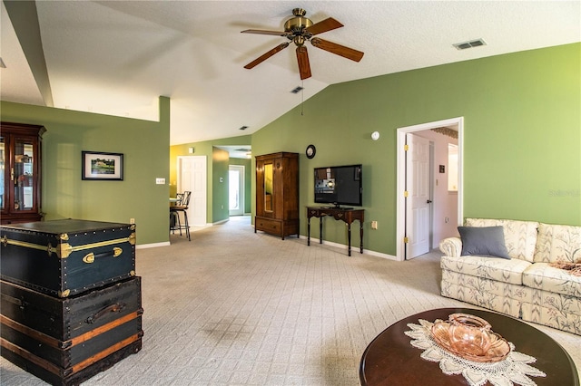 living room with light carpet, lofted ceiling, and ceiling fan