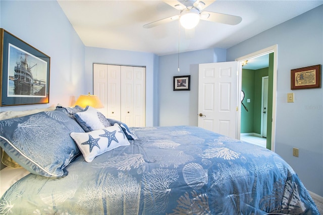 bedroom featuring ceiling fan and a closet