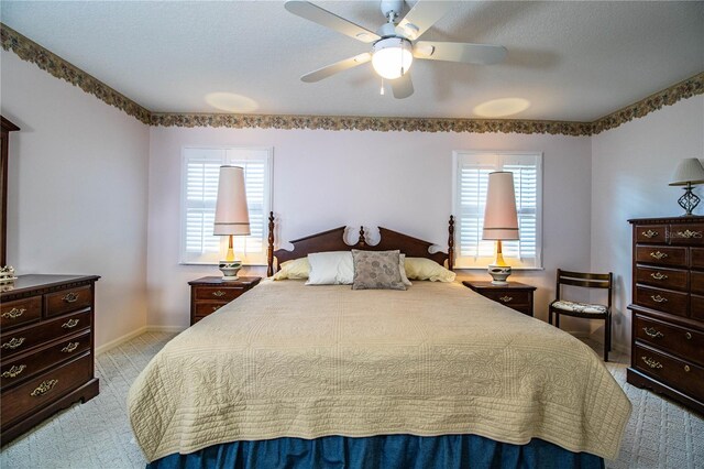 bedroom featuring ceiling fan and light colored carpet