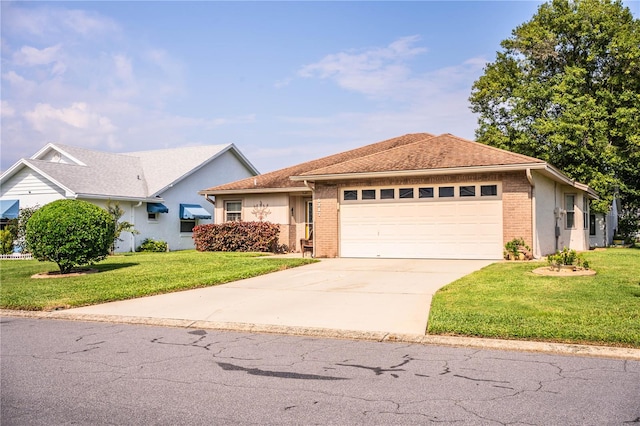 view of front of house with a front lawn and a garage