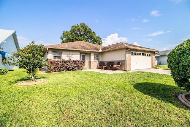 view of front of property featuring a front yard and a garage