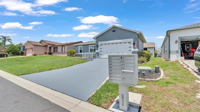 ranch-style house with a garage and a front lawn