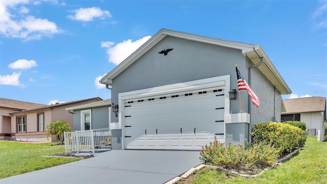 view of front facade featuring a garage and a front yard