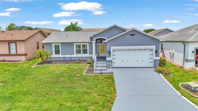 ranch-style house featuring a garage and a front yard