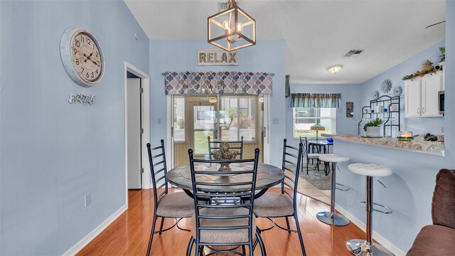 dining area with light hardwood / wood-style flooring