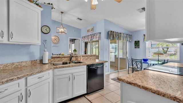 kitchen with white cabinets, dishwasher, and lofted ceiling