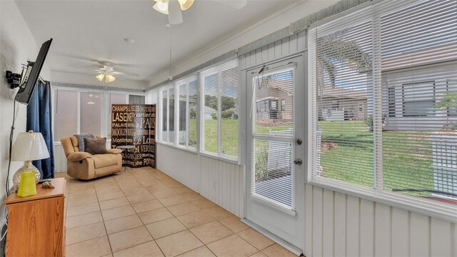 sunroom / solarium with ceiling fan