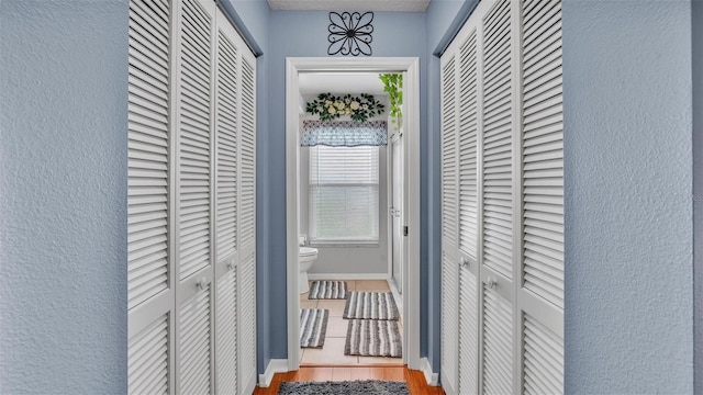 hallway featuring hardwood / wood-style floors