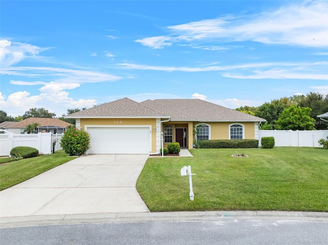 ranch-style house with a garage and a front lawn