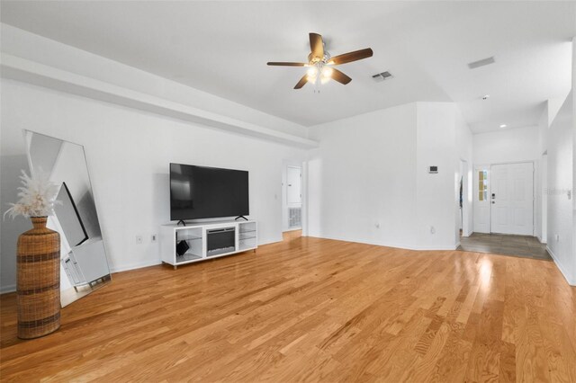 unfurnished living room featuring ceiling fan and light tile patterned floors