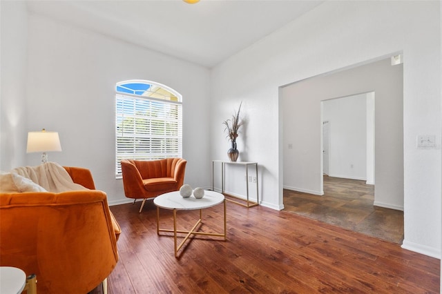 sitting room with dark hardwood / wood-style flooring