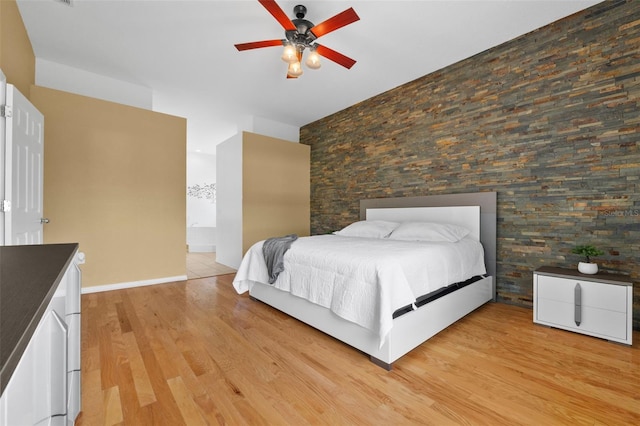 unfurnished bedroom featuring ceiling fan and light hardwood / wood-style flooring