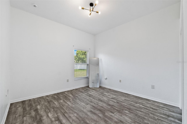 empty room with dark wood-type flooring