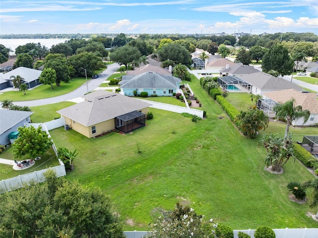 birds eye view of property with a water view