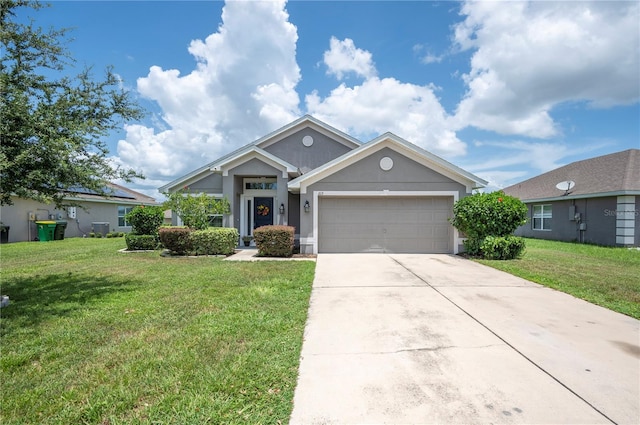 view of front of home featuring a garage and a front lawn