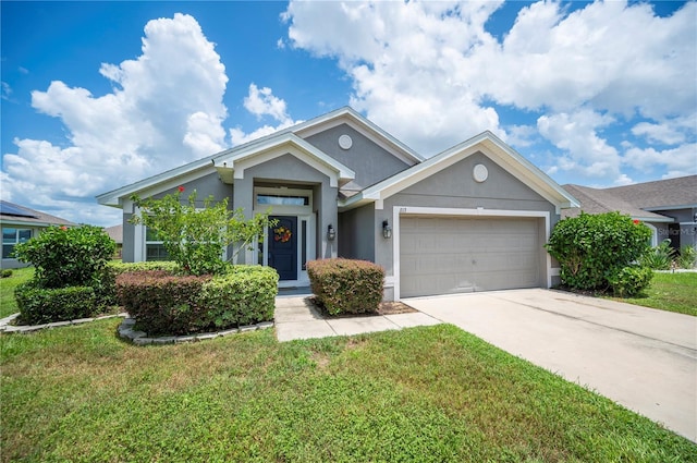 view of front of house featuring a garage and a front lawn