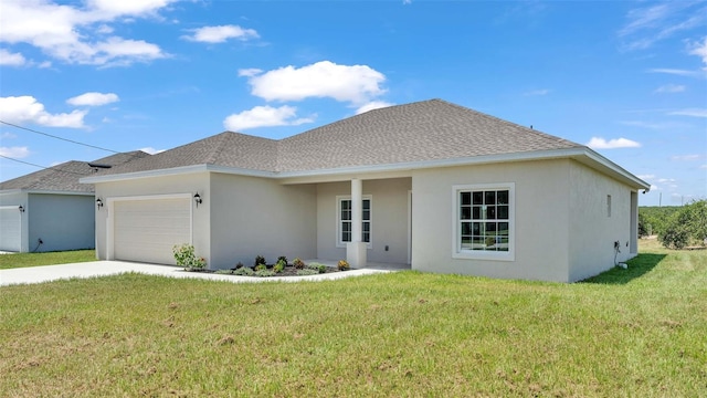 view of front of home with a garage and a front yard