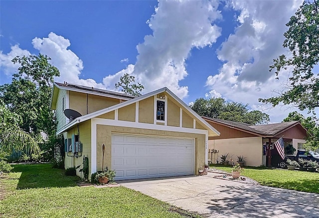 view of front of house featuring a garage and a front lawn