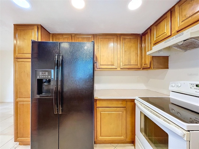 kitchen with white range with electric cooktop, black fridge with ice dispenser, and light tile patterned floors