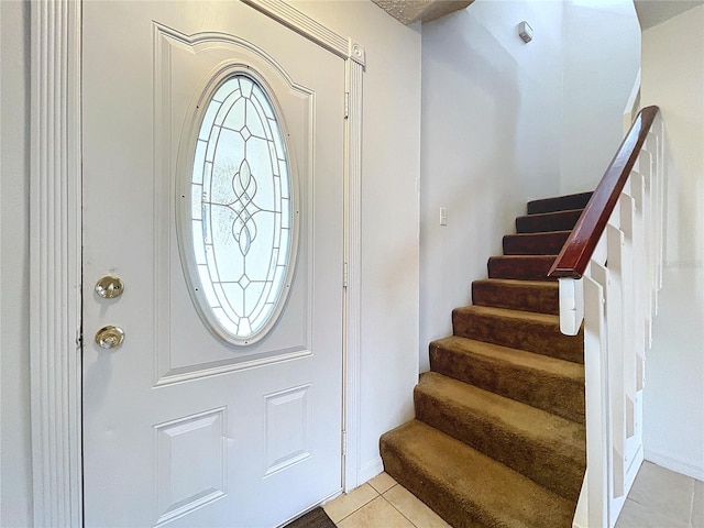 entrance foyer featuring light tile patterned floors