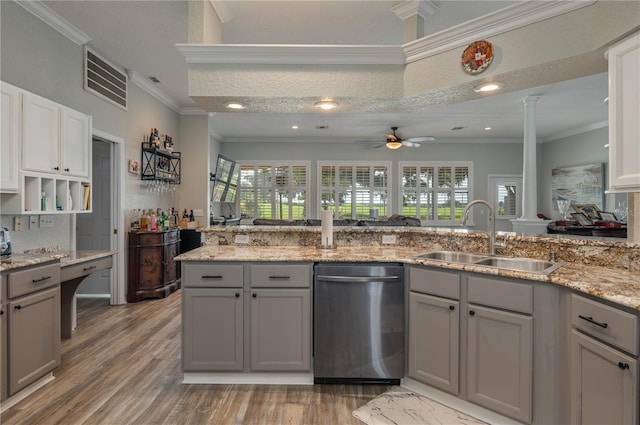 kitchen featuring sink, ornate columns, crown molding, gray cabinets, and dishwasher