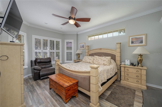 bedroom with multiple windows, ornamental molding, and ceiling fan