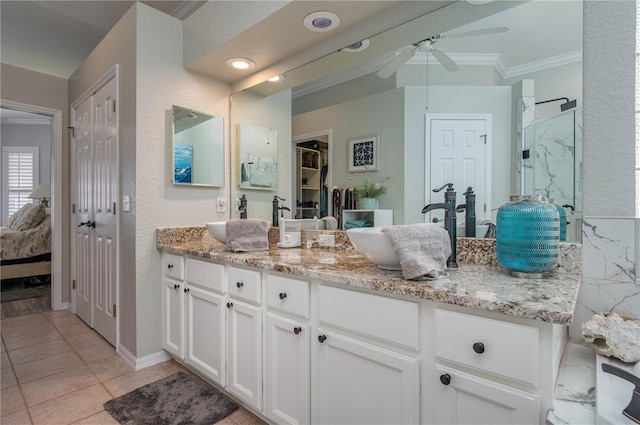 bathroom featuring vanity, tile patterned flooring, crown molding, and ceiling fan