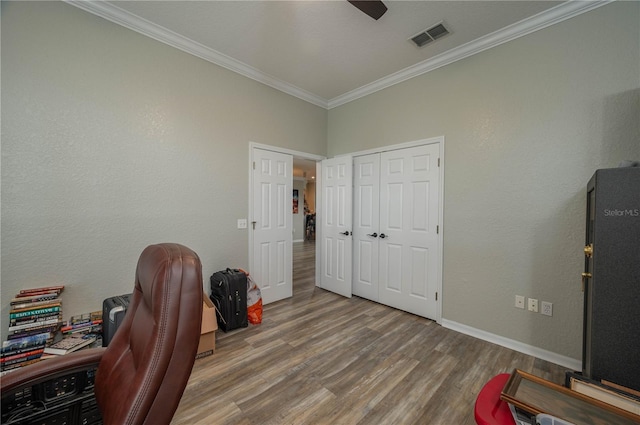 home office with hardwood / wood-style flooring, ornamental molding, and ceiling fan