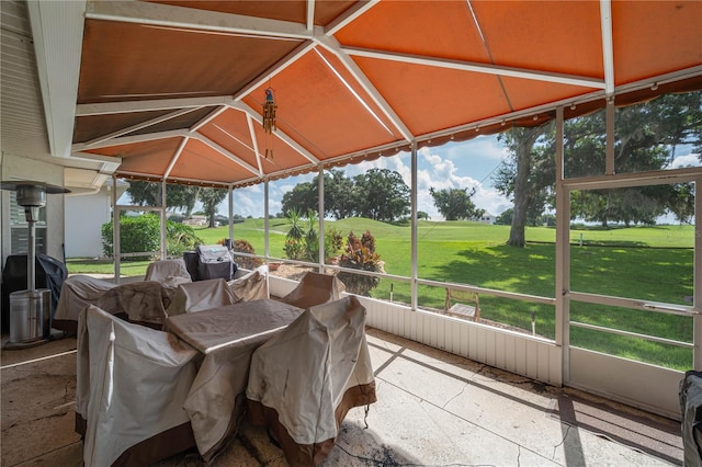 unfurnished sunroom with vaulted ceiling