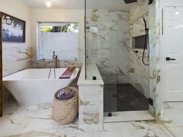 bathroom with plus walk in shower, tile patterned flooring, and tile walls