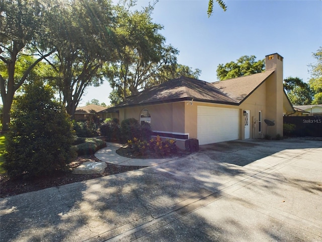 view of property exterior featuring a garage