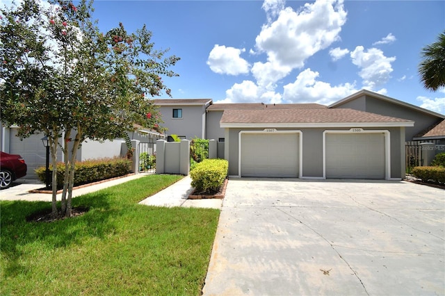 view of front facade with a garage and a front yard