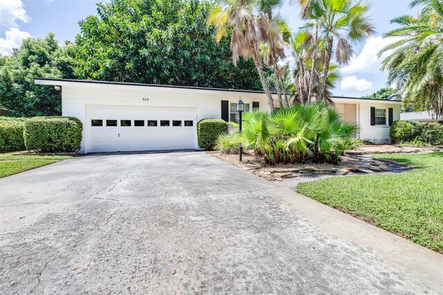 ranch-style home featuring a garage