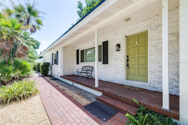 doorway to property featuring a porch