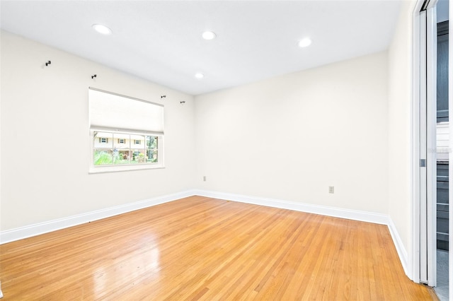 spare room featuring light hardwood / wood-style flooring