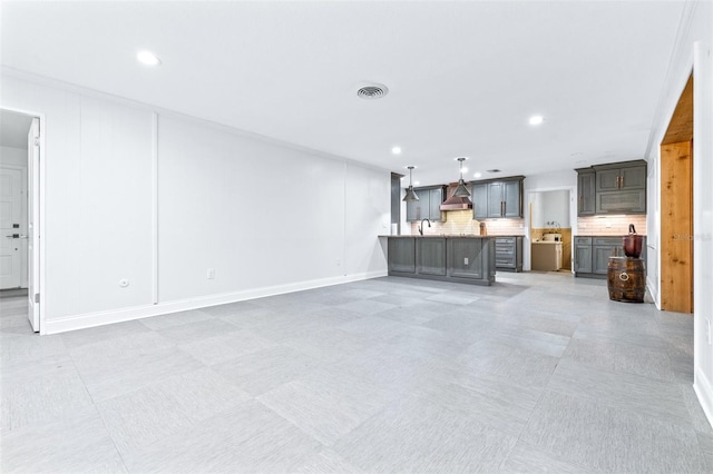 unfurnished living room with sink