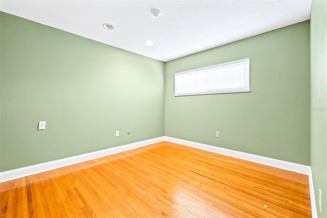 empty room featuring wood-type flooring