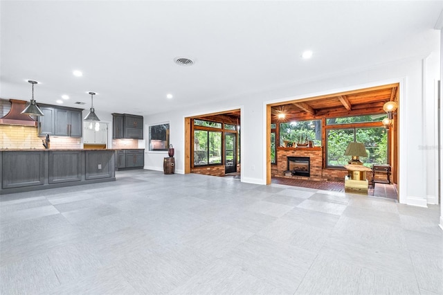 unfurnished living room with a healthy amount of sunlight