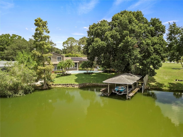 view of dock featuring a water view and a lawn