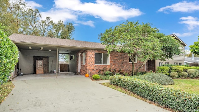 view of front of home featuring a carport