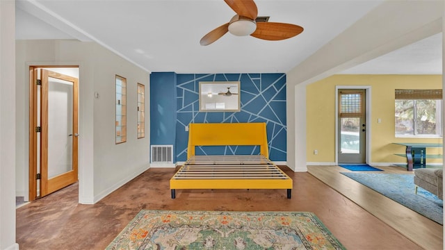 living area with concrete flooring and ceiling fan