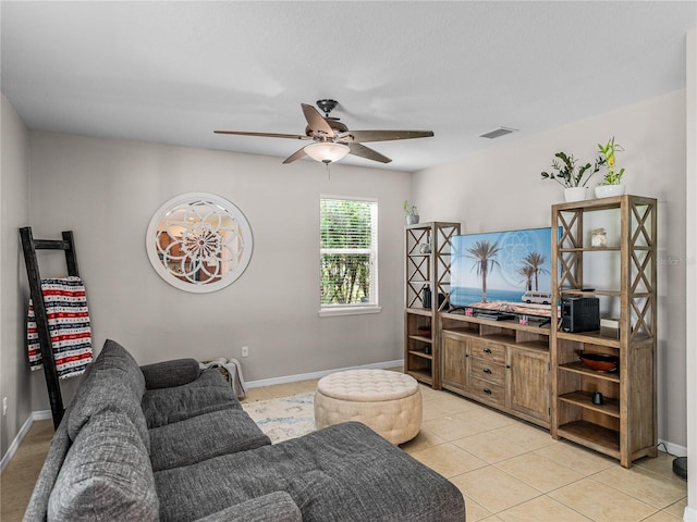 living room featuring light tile patterned floors and ceiling fan