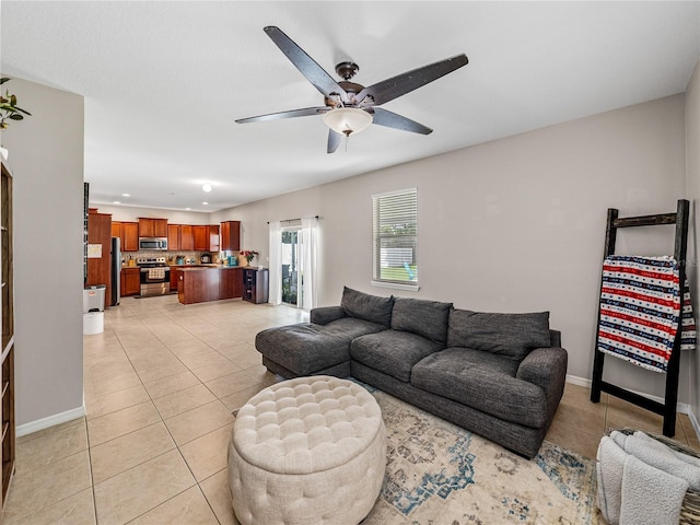 living room with light tile patterned floors and ceiling fan