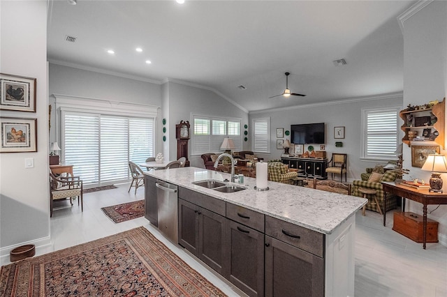 kitchen with sink, vaulted ceiling, stainless steel dishwasher, a healthy amount of sunlight, and a kitchen island with sink