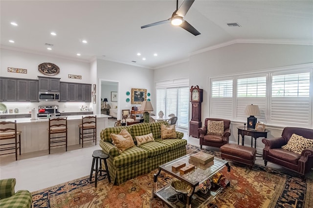 living room featuring sink, vaulted ceiling, ornamental molding, and ceiling fan