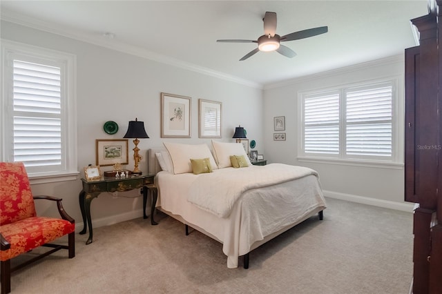 bedroom with crown molding, light colored carpet, and ceiling fan